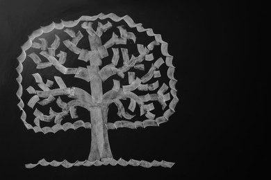 Photo of Beautiful drawing of tree on black chalkboard. Space for text