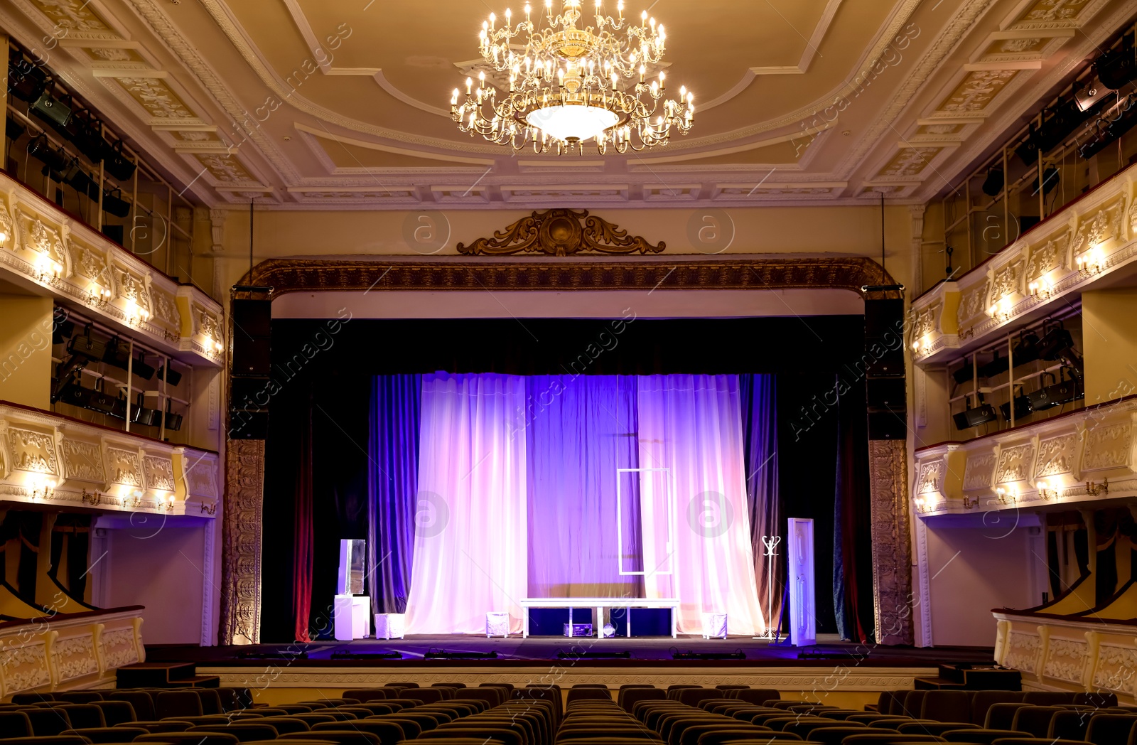 Photo of Theatre interior with stage and rows of comfortable seats