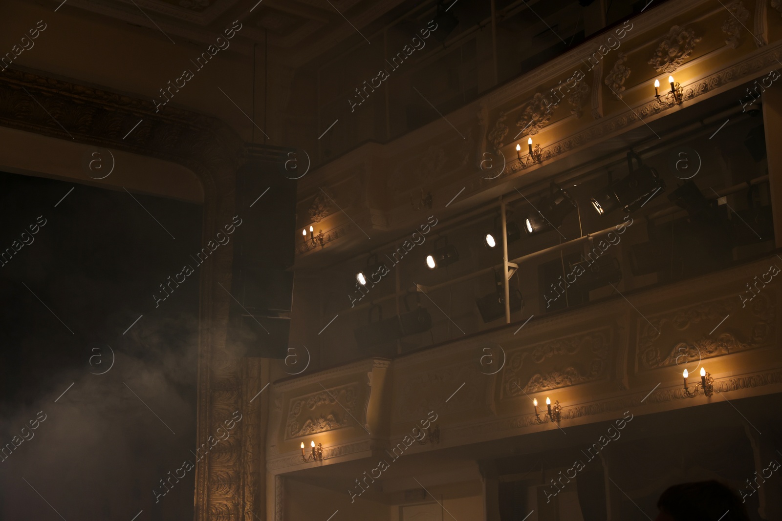 Photo of Professional spotlights and smoke in theatre, low angle view