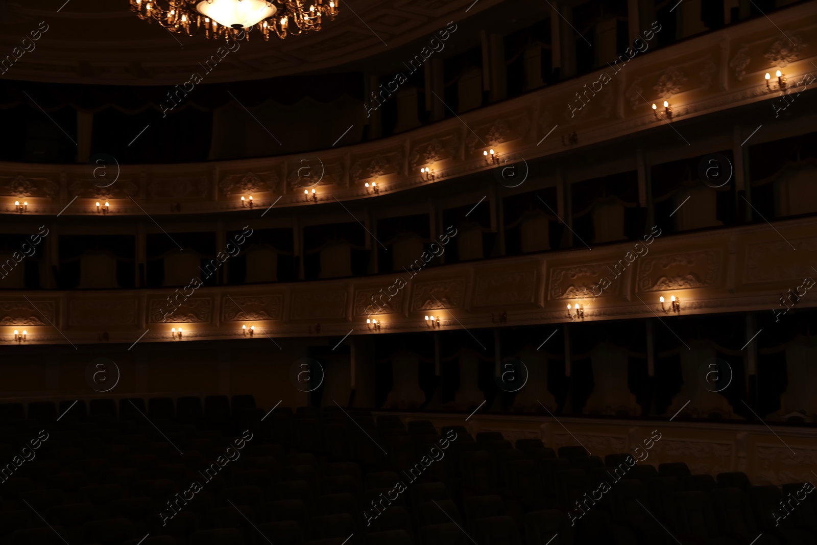 Photo of Balconies with vintage wall lamps in theatre