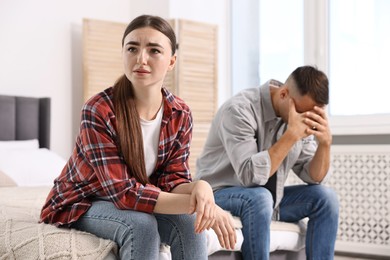 Offended couple ignoring each other at home