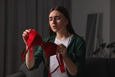 Frustrated wife with mistress bra alone at home