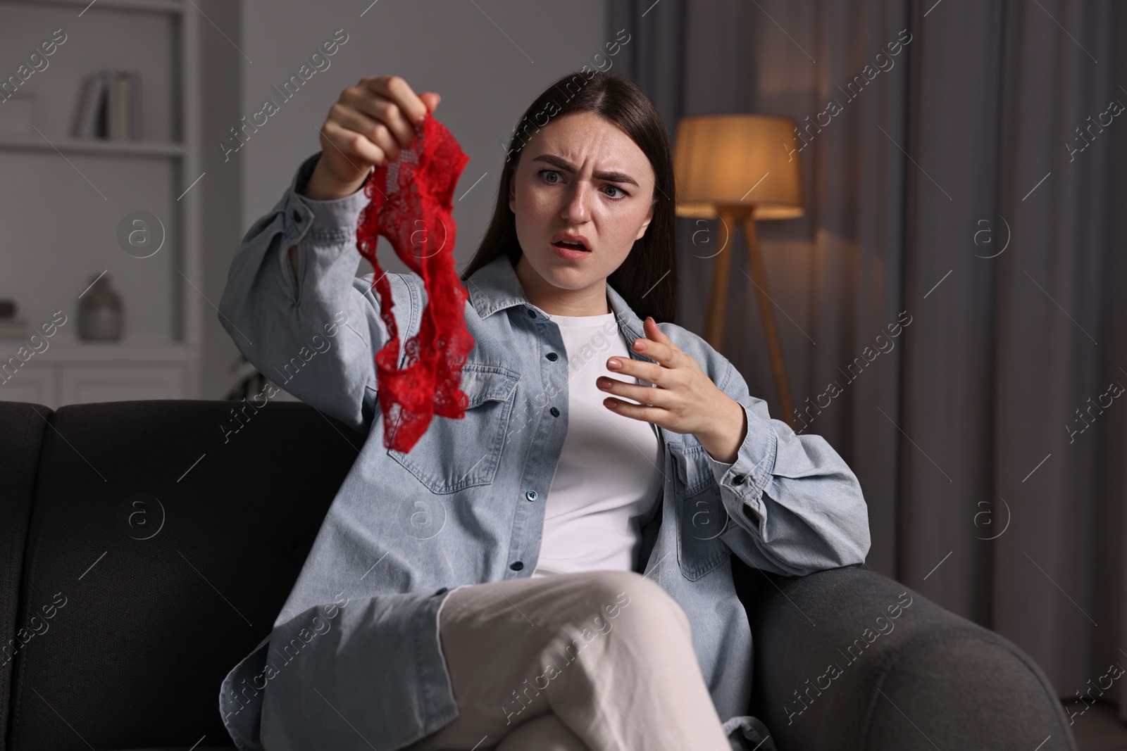 Photo of Surprised wife with mistress panties alone at home