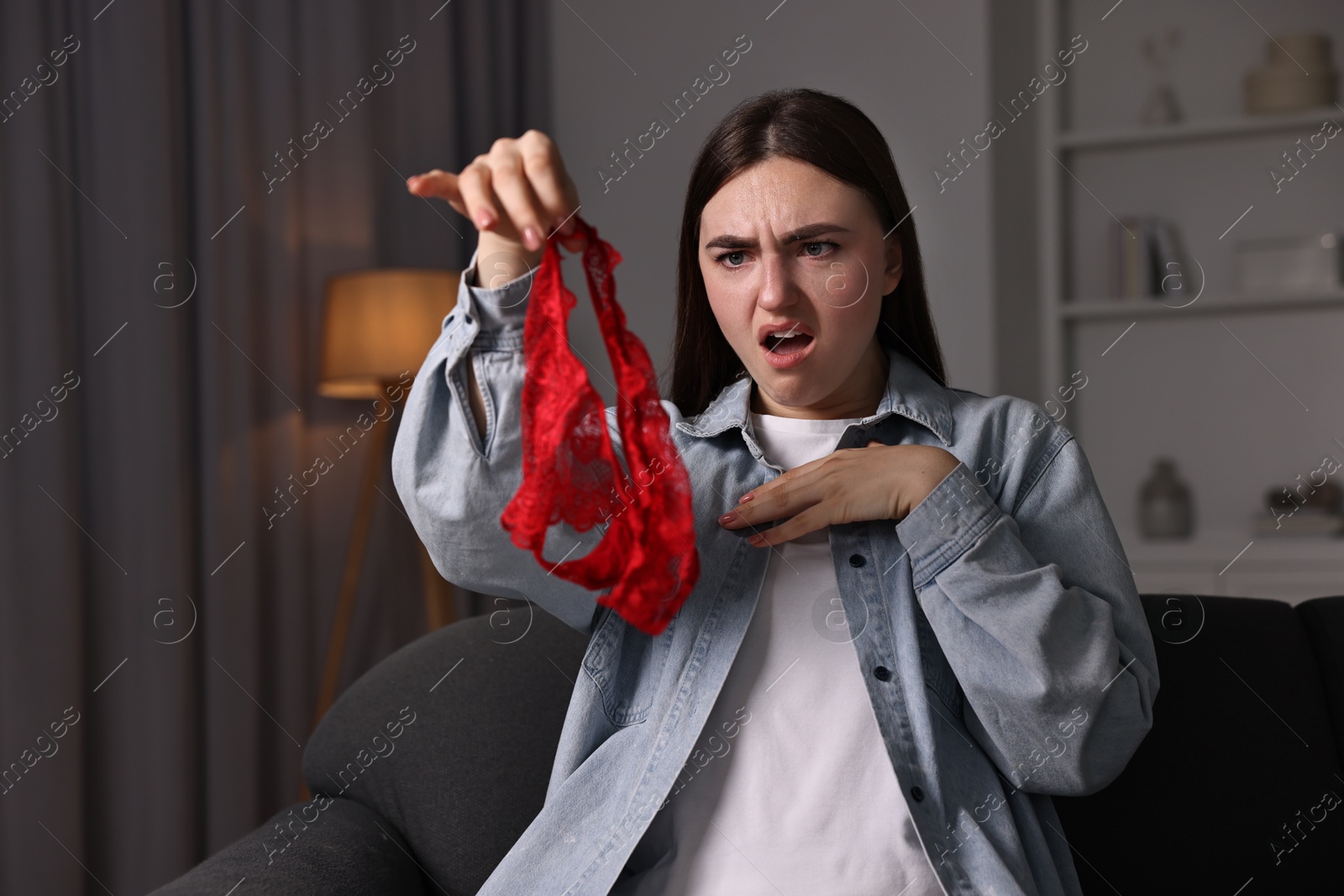 Photo of Surprised wife with mistress panties alone at home