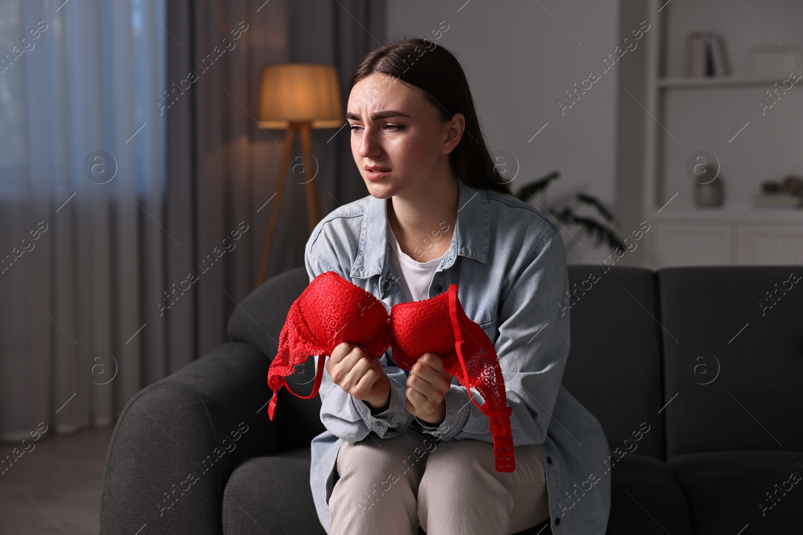 Photo of Frustrated wife with mistress bra alone at home