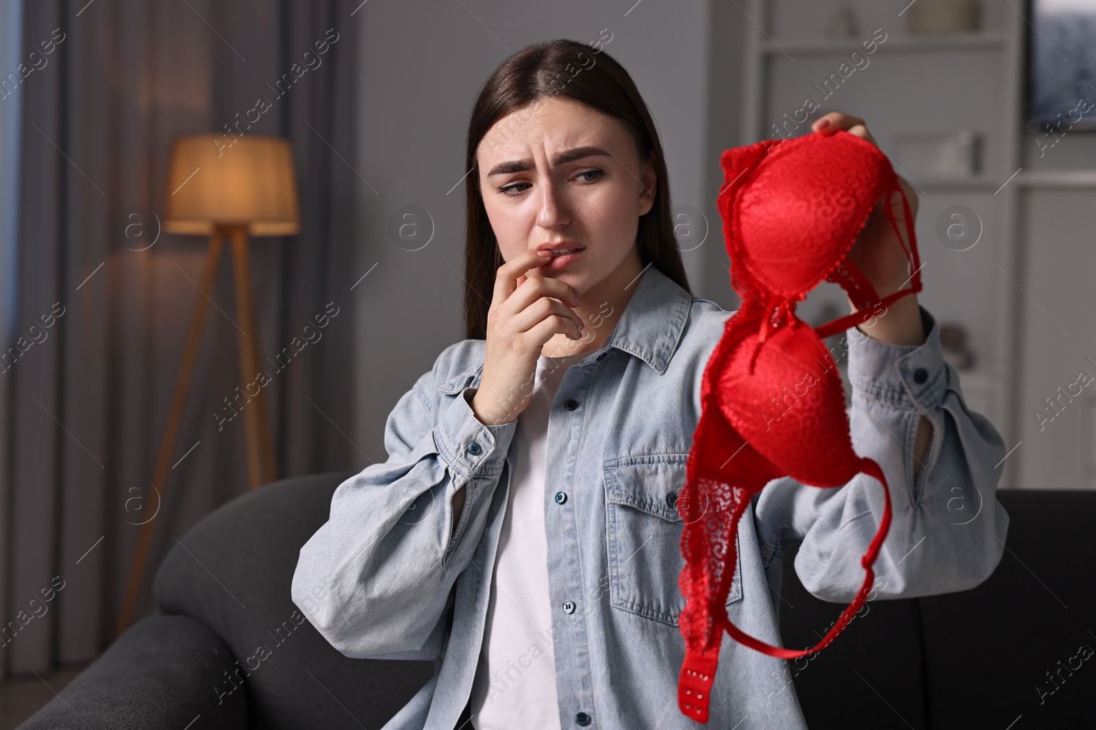 Photo of Frustrated wife with mistress bra alone at home