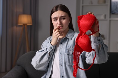 Frustrated wife with mistress bra alone at home