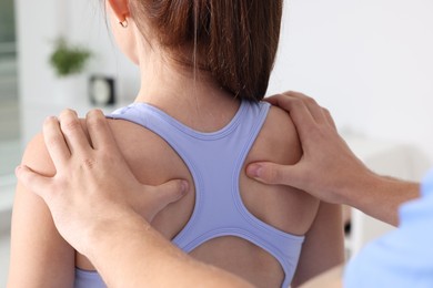 Photo of Osteopath working with patient in clinic, closeup. Manual therapy