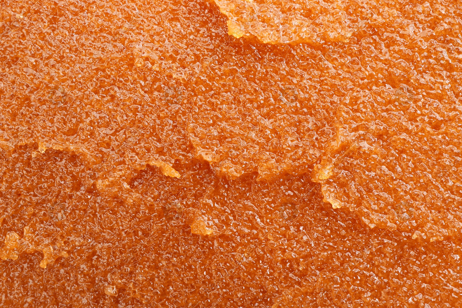 Photo of Sample of natural body scrub as background, closeup