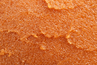 Photo of Sample of natural body scrub as background, closeup