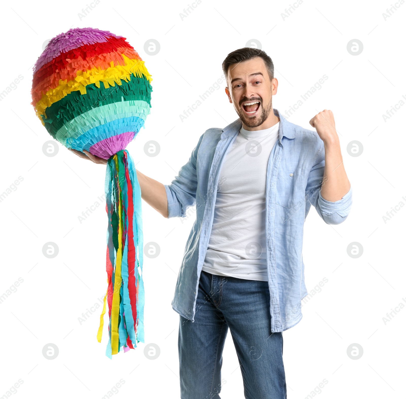 Photo of Emotional man with colorful pinata on white background