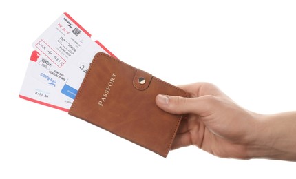 Photo of Travel agency. Man holding passport with flight tickets on white background, closeup