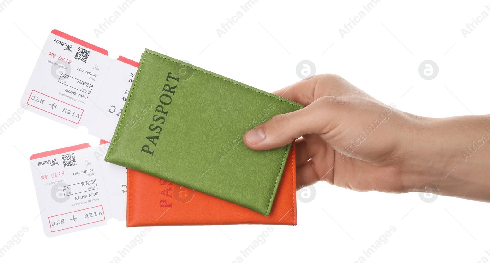 Photo of Travel agency. Man holding passports with flight tickets on white background, closeup