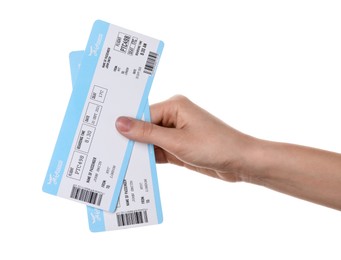 Photo of Travel agency. Woman holding flight tickets on white background, closeup