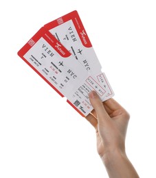 Photo of Travel agency. Woman holding flight tickets on white background, closeup