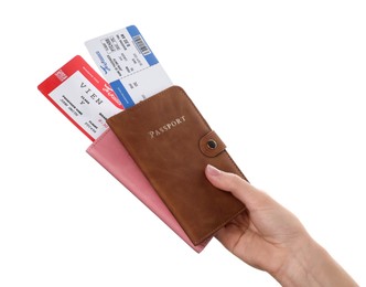 Photo of Travel agency. Woman holding flight tickets and passports on white background, closeup