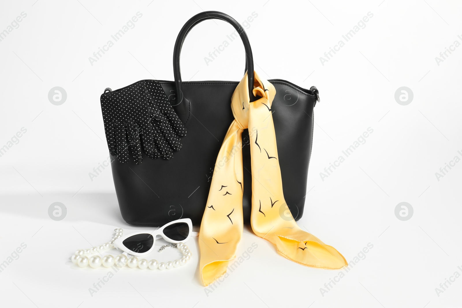 Photo of Stylish bag and other accessories on white background