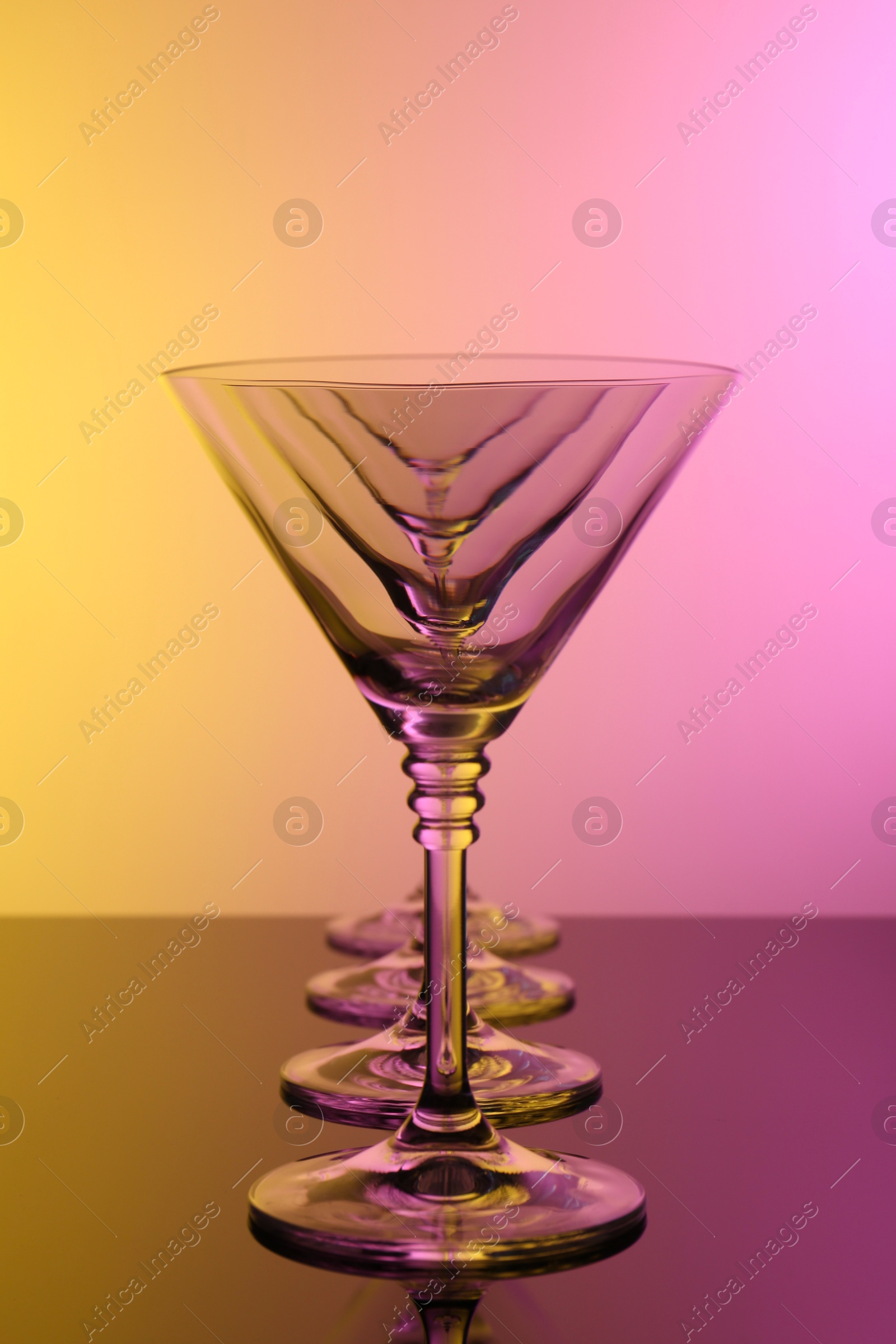 Photo of Empty glasses on table, color tone effect