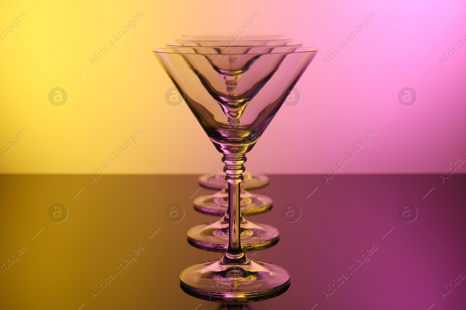 Photo of Empty glasses on table, color tone effect