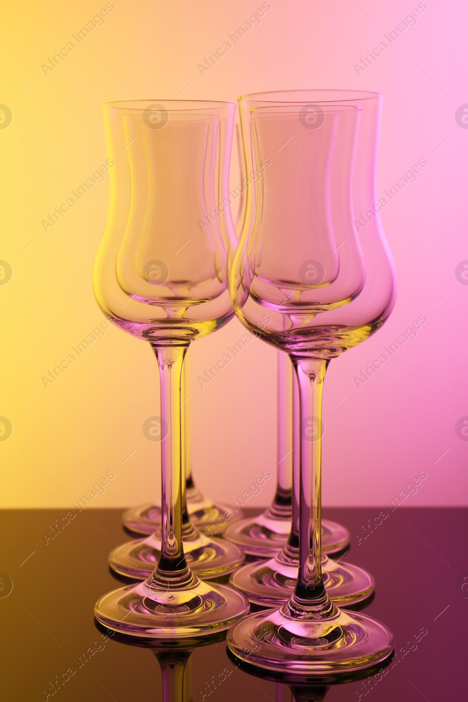 Photo of Empty glasses on table, color tone effect