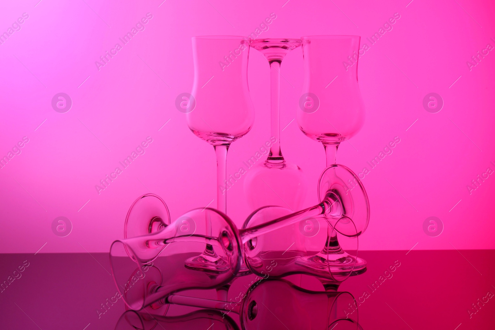 Photo of Empty glasses on table, color tone effect