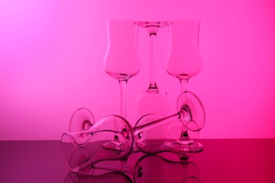 Photo of Empty glasses on table, color tone effect