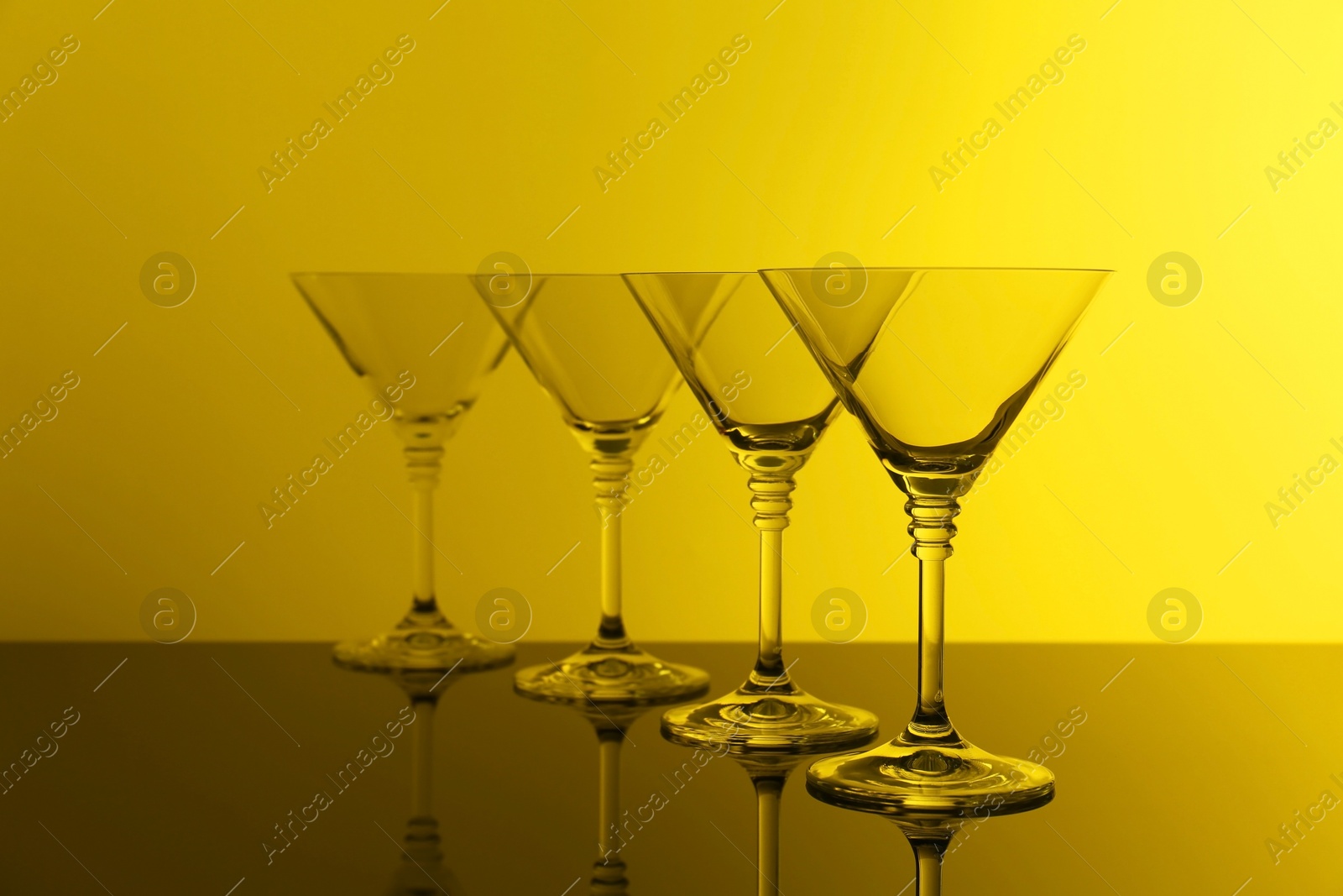 Photo of Empty glasses on table, color tone effect