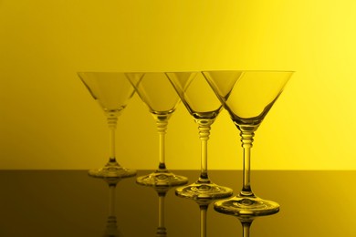 Photo of Empty glasses on table, color tone effect