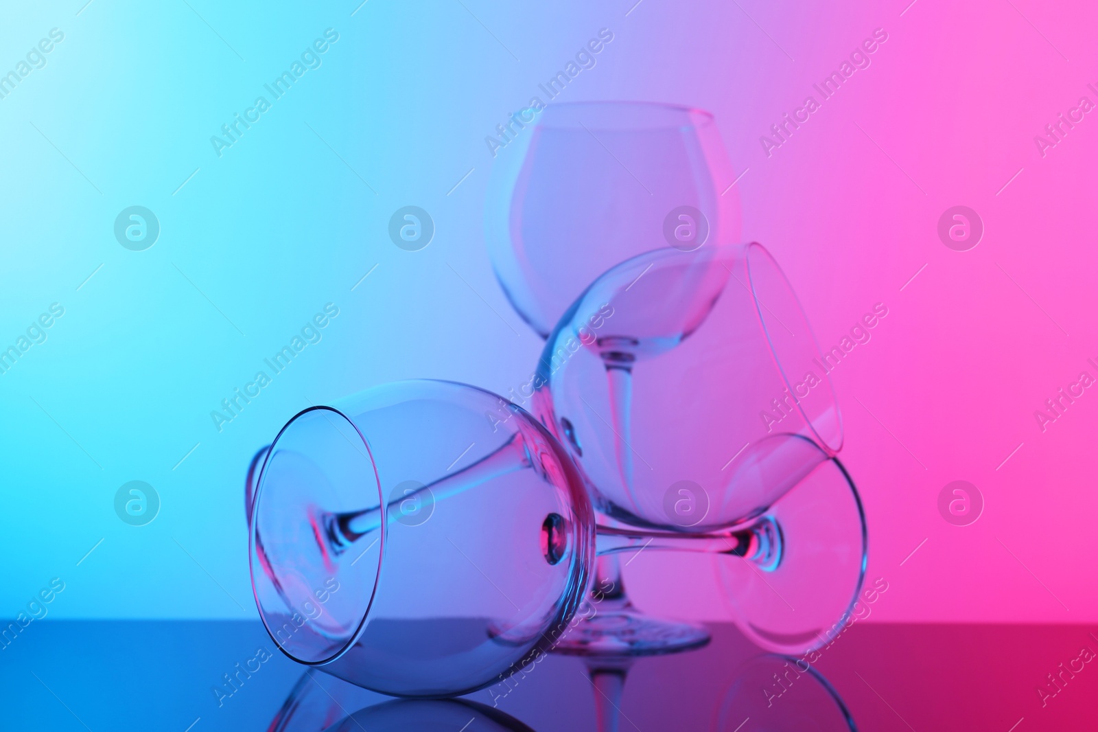 Photo of Empty glasses on table, color tone effect