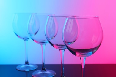 Photo of Empty glasses on table, color tone effect