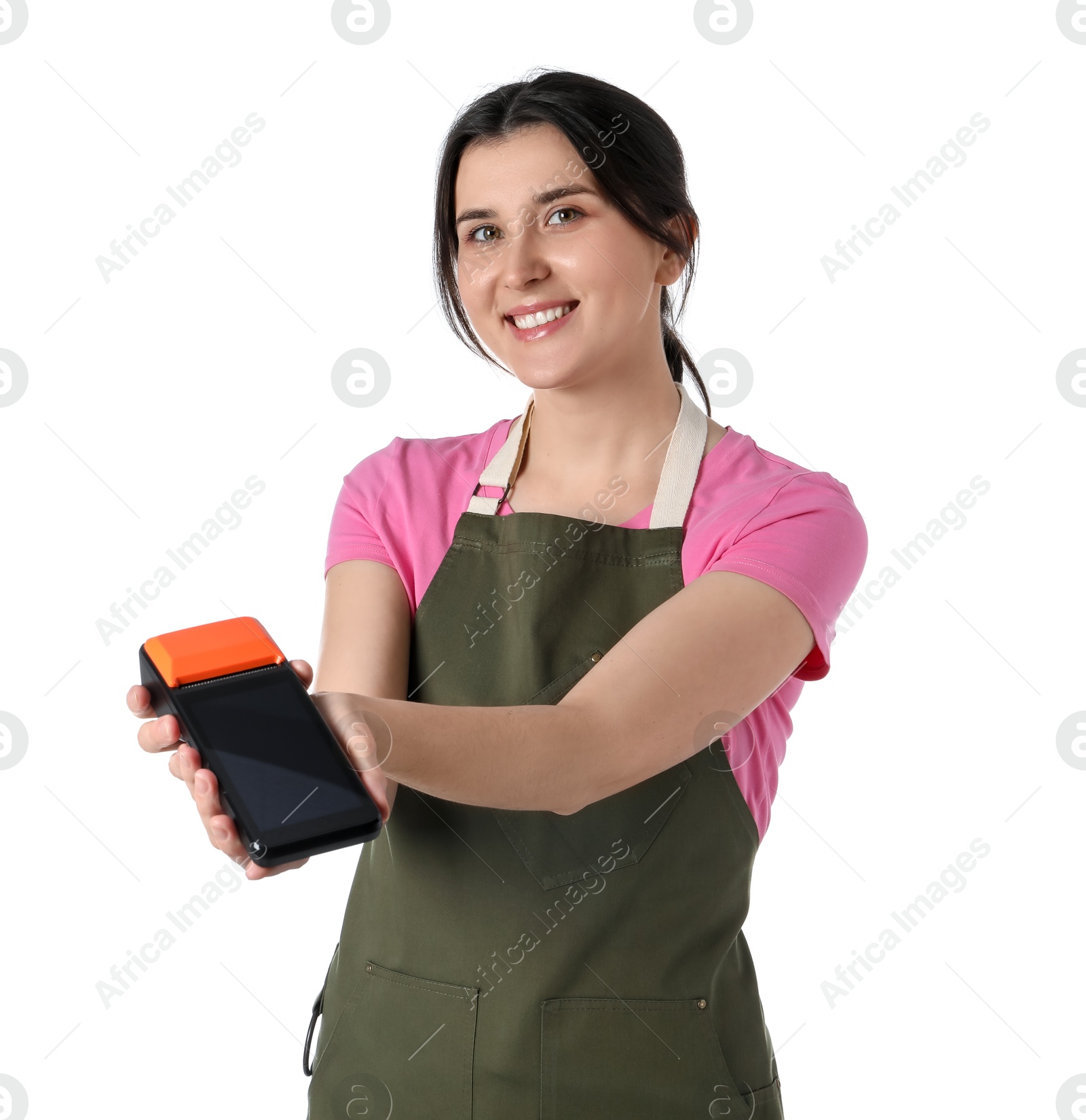 Photo of Happy young woman in apron with payment terminal on white background