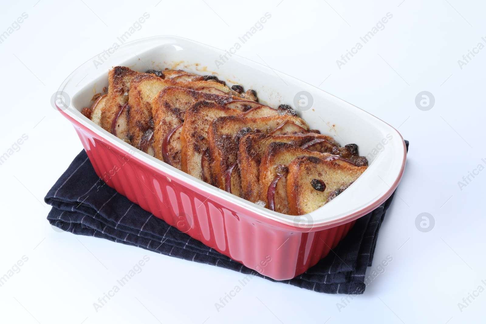 Photo of Delicious bread pudding in baking dish isolated on white