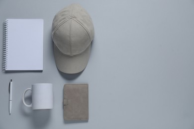 Photo of Different blank items for branding on gray background, flat lay. Mockup for design