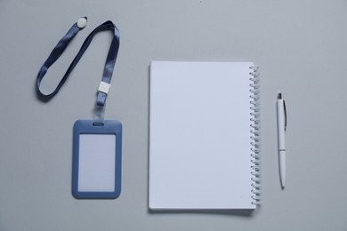 Photo of Different blank items for branding on gray background, flat lay. Mockup for design