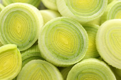 Photo of Chopped fresh leek as background, closeup view