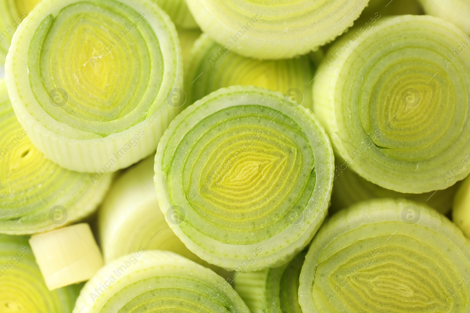 Photo of Chopped fresh leek as background, closeup view