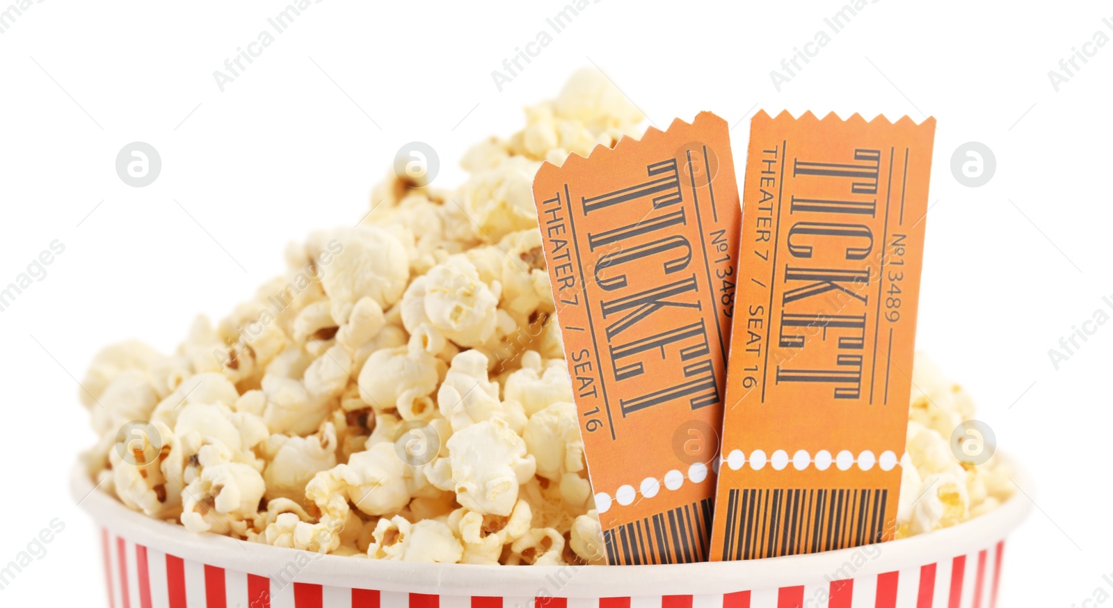 Photo of Tasty popcorn and movie tickets isolated on white