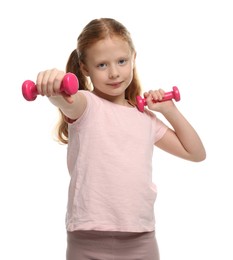 Photo of Cute little girl exercising with dumbbells on white background