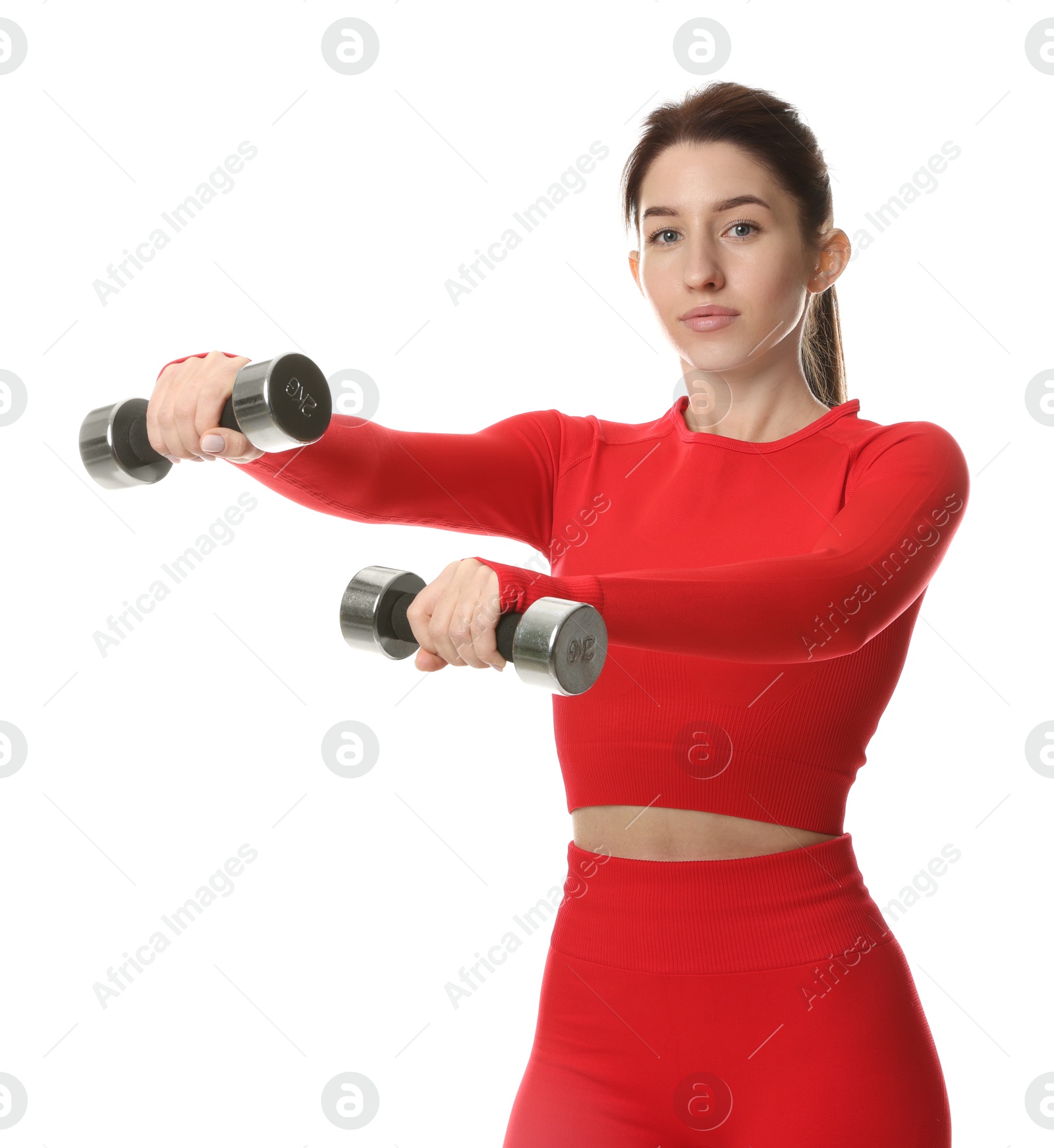 Photo of Woman in sportswear exercising with dumbbells on white background