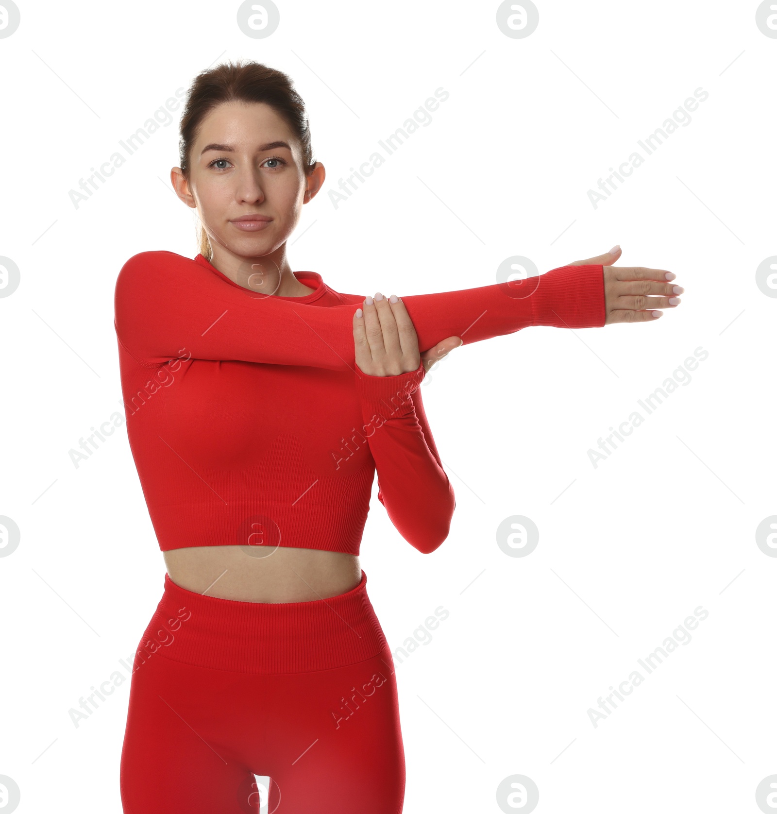 Photo of Woman in sportswear exercising on white background