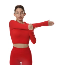 Photo of Woman in sportswear exercising on white background