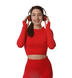 Photo of Woman in sportswear and headphones on white background