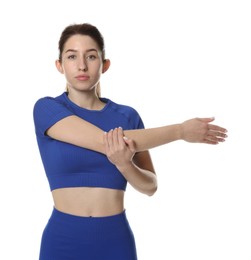 Woman in sportswear exercising on white background