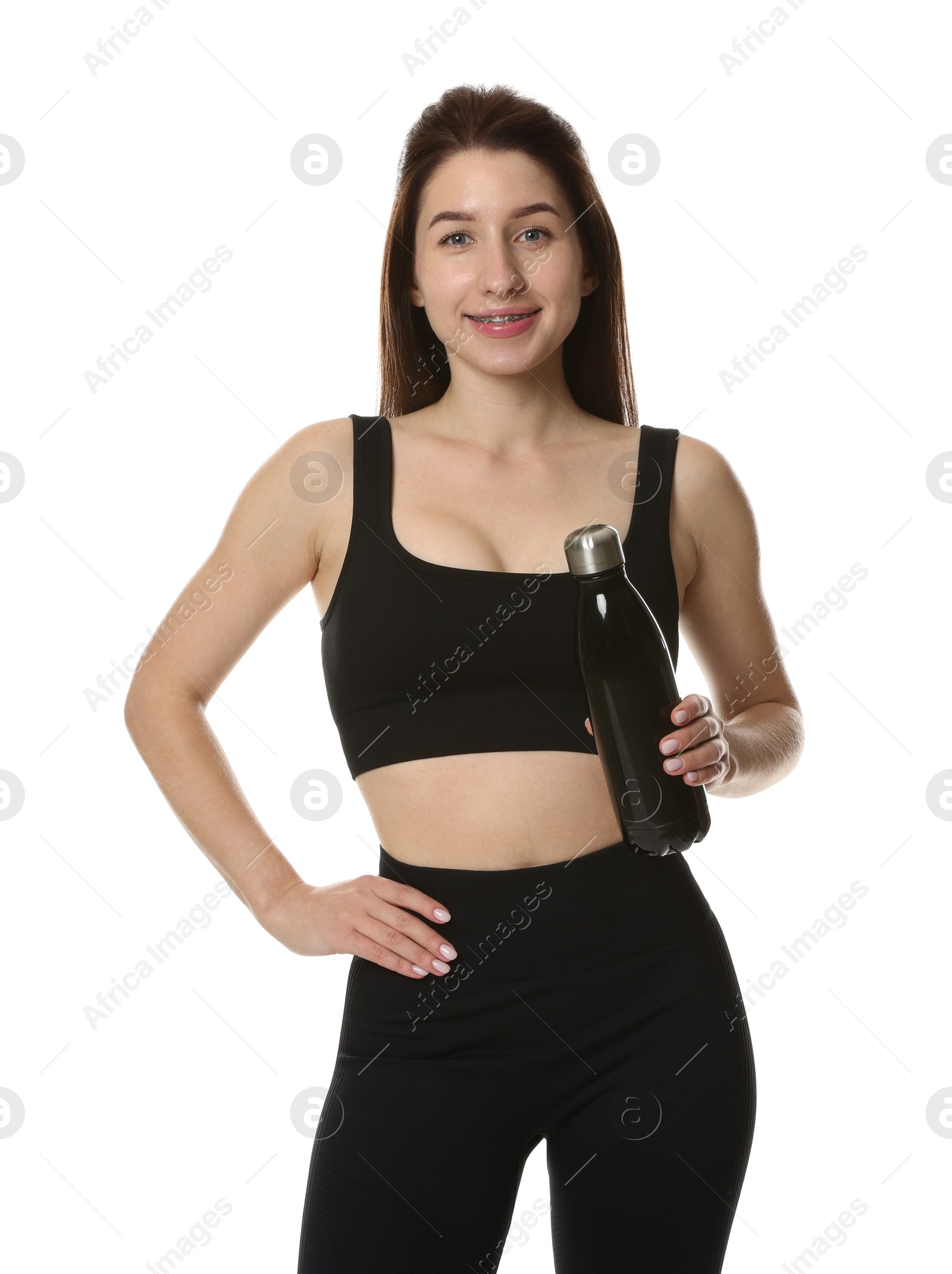 Photo of Woman in sportswear with thermo bottle on white background