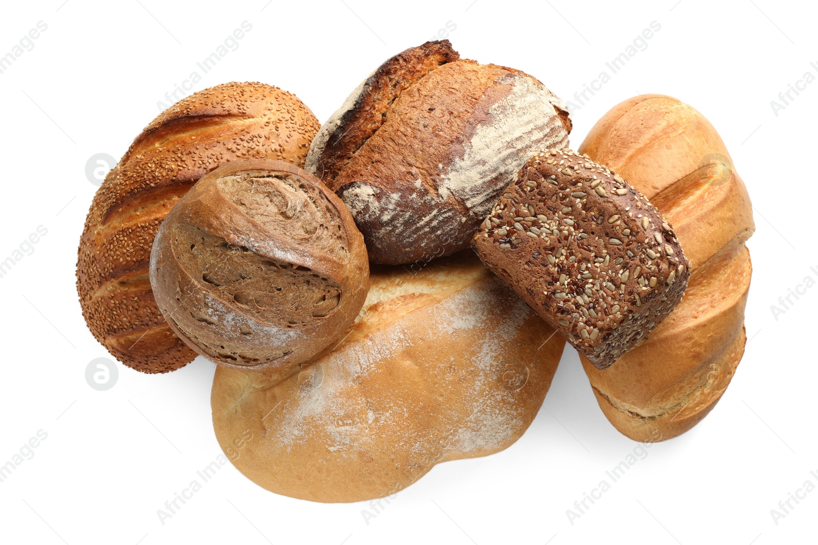 Photo of Different freshly baked bread loafs isolated on white, top view