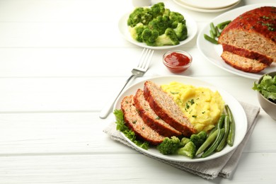 Photo of Delicious baked turkey meatloaf with mashed potato served on white wooden table, space for text