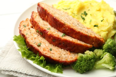 Photo of Delicious baked turkey meatloaf with mashed potato served on table, closeup