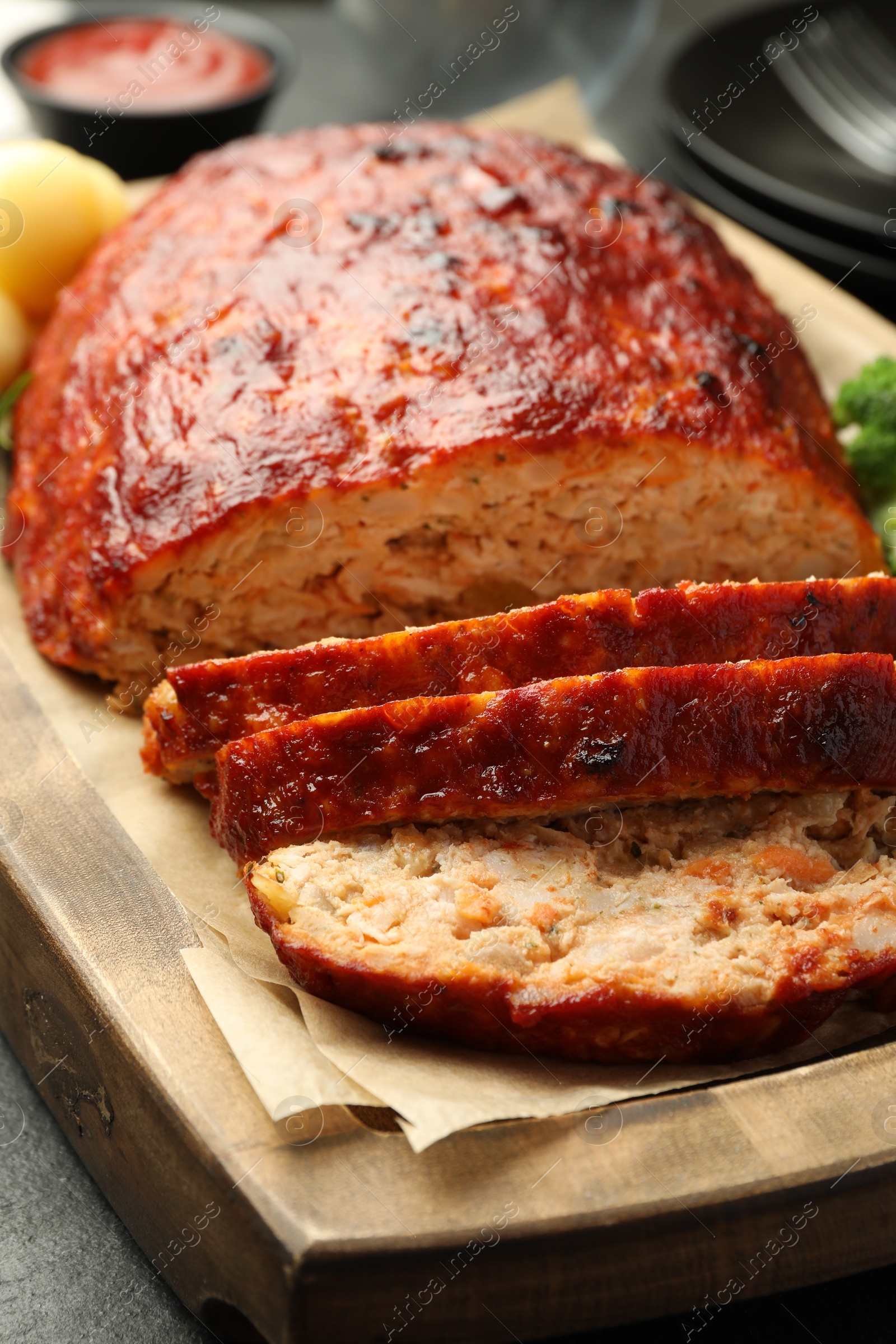 Photo of Delicious baked turkey meatloaf on table, closeup