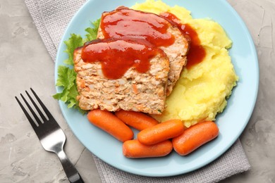 Photo of Delicious baked turkey meatloaf with mashed potato served on grey table, top view