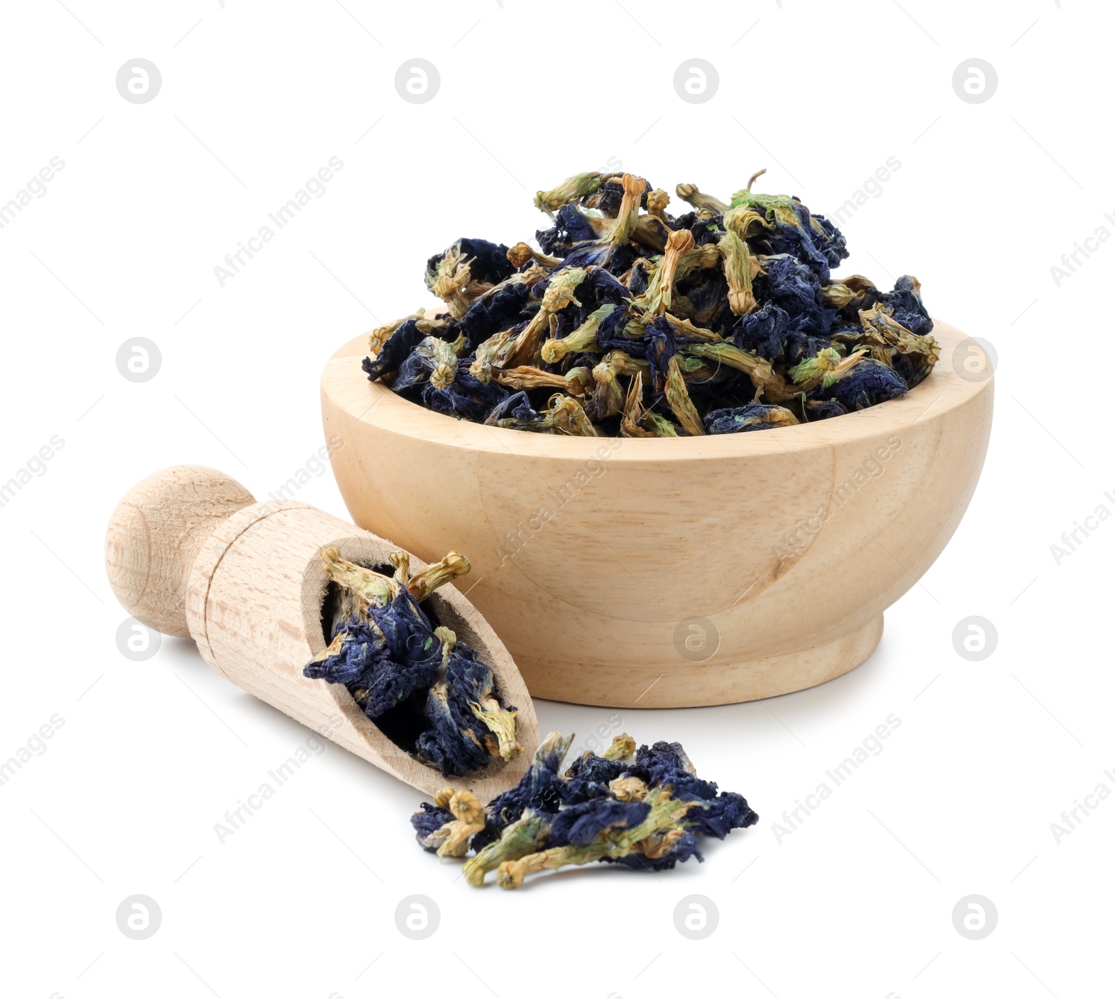 Photo of Butterfly pea flower tea. Dry Clitoria ternatea petals in bowl and scoop isolated on white